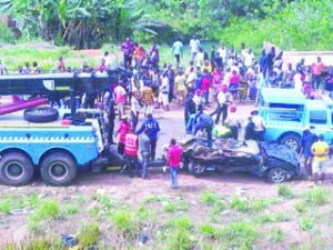 Federal Road Safety officials at the scene where an SUV crashed on Benin expressway on Monday