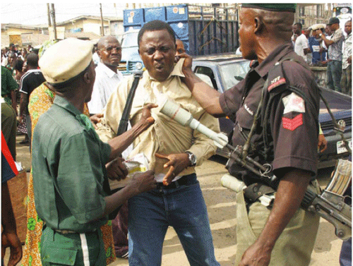 Security operatives malhandling a journalist