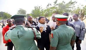Officers from COAS convoy pleading with youth who erected road block