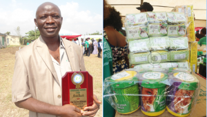 Jimoh displaying AMEN's best product award 2014 and (right) Some of Jim Herbal products