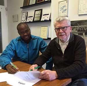 Quadri (left) with JOOLA Managing Director, Michael Bachtler during the signing of an improved contract with the Germany-based kit giant in Frankfurt.