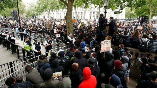 Demonstrators and police in Whitehall