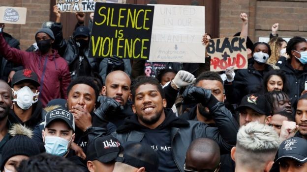 Boxer Anthony Joshua joined protesters in Watford